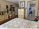 Bright bedroom with connecting bathroom, featuring an eye-catching gallery wall and neutral tones at 15576 W Coral Pointe Dr, Surprise, AZ 85374