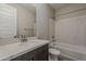 Bathroom featuring a single sink vanity, shower and bathtub combination at 31969 N 117Th Ave, Peoria, AZ 85383