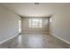 Spacious living room featuring tile floors, natural light and access to a front entry at 31969 N 117Th Ave, Peoria, AZ 85383