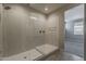 Walk-in shower featuring beautiful tile work, rainfall shower head and a glass enclosure at 31969 N 117Th Ave, Peoria, AZ 85383