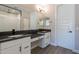 Modern bathroom with dual sinks, granite countertops, and large mirrors at 31985 N 117Th Ave, Peoria, AZ 85383