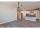 Open-concept design showcasing the kitchen, dining, and living areas with stylish finishes and ample space at 31985 N 117Th Ave, Peoria, AZ 85383