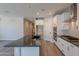 Stylish kitchen with a center island, white cabinets, and stainless steel appliances, creating a functional space at 31985 N 117Th Ave, Peoria, AZ 85383