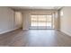 Bright living room with sliding glass doors to outdoor patio area, allowing for easy indoor-outdoor living at 31985 N 117Th Ave, Peoria, AZ 85383