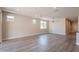 Open living area featuring neutral walls, gray floors, recessed lighting, and a seamless transition to the kitchen at 31985 N 117Th Ave, Peoria, AZ 85383