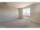 Comfortable bedroom with carpet, a window, and neutral paint perfect for relaxation at 32018 N 117Th Ave, Peoria, AZ 85383