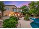 Expansive backyard with lush landscaping, covered patio, and sparkling blue pool at 1201 W Washington Ave, Gilbert, AZ 85233