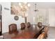 Open floorplan showcasing the dining area with a large table and lots of light at 1201 W Washington Ave, Gilbert, AZ 85233