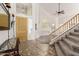 Bright foyer featuring tile flooring and a staircase at 1201 W Washington Ave, Gilbert, AZ 85233