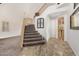 Bright foyer with tile flooring and staircase at 1201 W Washington Ave, Gilbert, AZ 85233
