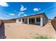 Large backyard with patio perfect for outdoor entertaining, all in a low maintenance desert landscape at 1329 W Via De Olivos Dr, San Tan Valley, AZ 85140