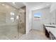 Spa-like bathroom with a glass-enclosed shower, dual vanities, and modern fixtures at 1329 W Via De Olivos Dr, San Tan Valley, AZ 85140