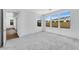 Spacious, bright bedroom with large windows offering plenty of natural light and neutral toned carpeting at 1329 W Via De Olivos Dr, San Tan Valley, AZ 85140