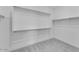 Walk-in closet with ample shelving and hanging space for organized storage solutions at 1329 W Via De Olivos Dr, San Tan Valley, AZ 85140