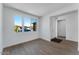 Inviting entryway showcasing natural light with wood floors, perfect for a welcoming ambiance at 1329 W Via De Olivos Dr, San Tan Valley, AZ 85140