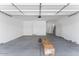 Spacious two car garage featuring ample room for parking, storage and neutral colored walls at 1329 W Via De Olivos Dr, San Tan Valley, AZ 85140