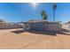 Spacious backyard with desert landscaping, a covered patio, and block wall at 7508 W Osborn Rd, Phoenix, AZ 85033