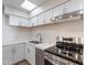 Beautiful kitchen featuring stainless appliances, modern white cabinets, and neutral countertops at 7508 W Osborn Rd, Phoenix, AZ 85033