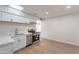 Bright kitchen featuring modern stainless appliances, white cabinets, and sleek countertops at 7508 W Osborn Rd, Phoenix, AZ 85033