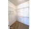 Walk-in closet with carpet and wire shelving for ample storage space at 17089 W Links Dr, Surprise, AZ 85387