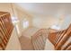 Bright foyer with view from second story showcases staircase, high ceilings, and modern lighting at 695 W Estrella Dr, Gilbert, AZ 85233