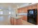 Well-appointed kitchen boasting a center island and stainless steel appliances at 695 W Estrella Dr, Gilbert, AZ 85233