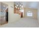 Bright living room with large windows, modern lighting, and seamless flooring at 695 W Estrella Dr, Gilbert, AZ 85233