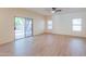 Bright living room with large sliding glass doors and seamless flooring at 695 W Estrella Dr, Gilbert, AZ 85233