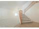 Bright, open living room featuring staircase, neutral carpet, and ample natural light at 695 W Estrella Dr, Gilbert, AZ 85233
