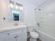Bathroom is equipped with a shower-tub combo and a large vanity and updated fixtures at 3801 E Captain Dreyfus Ave, Phoenix, AZ 85032
