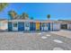 Charming single-story home features a blue exterior, a bright yellow front door, and low-maintenance landscaping at 3801 E Captain Dreyfus Ave, Phoenix, AZ 85032