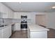 Modern kitchen featuring stainless steel appliances, white cabinets, countertops and a center island at 3801 E Captain Dreyfus Ave, Phoenix, AZ 85032