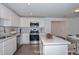 Modern kitchen featuring white cabinets, stainless steel appliances, and a stylish backsplash at 3801 E Captain Dreyfus Ave, Phoenix, AZ 85032