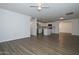 Open-concept living room with wood flooring, natural light, and ample space at 3801 E Captain Dreyfus Ave, Phoenix, AZ 85032