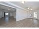 Open floor plan living area with wood floors and natural light at 3801 E Captain Dreyfus Ave, Phoenix, AZ 85032