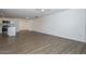 Spacious living room with modern wood flooring and neutral walls at 3801 E Captain Dreyfus Ave, Phoenix, AZ 85032