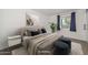 Comfortable main bedroom with a large bed, stylish decor, a neutral color palette, and natural light at 3801 E Captain Dreyfus Ave, Phoenix, AZ 85032