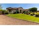 Single-story home featuring a well-maintained lawn and desert landscaping at 19575 E Vallejo St, Queen Creek, AZ 85142