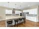 Bright kitchen featuring a large granite island, stainless steel appliances, and pendant lighting at 19575 E Vallejo St, Queen Creek, AZ 85142