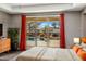 Main bedroom view with a sliding door looking onto an immaculate backyard with a pool and spa at 19575 E Vallejo St, Queen Creek, AZ 85142