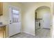 Convenient laundry room featuring modern appliances, cabinets, and backyard access providing functionality and style at 8209 W Raven Dr, Arizona City, AZ 85123