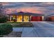 Single-story home with red garage door and covered porch at 16567 W Mckinley St, Goodyear, AZ 85338