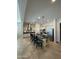 Open kitchen with center island and seating, stainless steel appliances and adjacent dining area at 4142 E Zion Pl, Chandler, AZ 85249