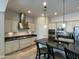 Modern kitchen featuring stainless steel appliances, sleek cabinetry, and a functional center island with breakfast bar at 4142 E Zion Pl, Chandler, AZ 85249