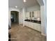 Kitchenette with classic cabinets and countertop, conveniently located near other living spaces at 4142 E Zion Pl, Chandler, AZ 85249