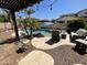 Outdoor pool area featuring a beautiful pool, lounge seating, and decorative landscaping elements under a bright, sunny sky at 4142 E Zion Pl, Chandler, AZ 85249