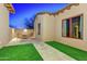 Charming patio area with artificial turf, a seating area, and vibrant exterior architecture at 3129 S Honeysuckle Ct, Gold Canyon, AZ 85118