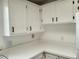 Clean kitchen featuring white cabinets and white countertops with black cabinet pulls at 17200 W Bell Rd # 1637, Surprise, AZ 85374