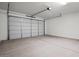 Spacious garage with a large door and concrete flooring at 1426 E Jaycie Dr, Casa Grande, AZ 85122