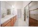 Bathroom with double sink vanity and mirrored closet at 4525 N 22Nd St # 404, Phoenix, AZ 85016
